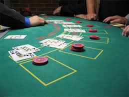 Mobile phone displaying toto7788 login live casino table with dealer and betting interface